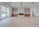 Spacious living room featuring a modern fireplace and large sliding glass doors at 4266 La Salle Ave, St Cloud, FL 34772