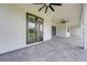 Covered patio featuring ceiling fans and a brick paver floor, perfect for outdoor entertaining at 4266 La Salle Ave, St Cloud, FL 34772