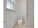 Bright powder room with neutral paint and modern toilet at 4266 La Salle Ave, St Cloud, FL 34772