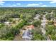 Expansive aerial view of a suburban neighborhood featuring lush green trees and well-maintained streets at 4274 Meeting Pl, Sanford, FL 32773