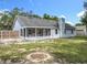 The backyard of the home features a fire pit and wooden fence at 4274 Meeting Pl, Sanford, FL 32773