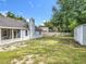 Spacious backyard featuring a storage shed, wooden fence and the home's exterior at 4274 Meeting Pl, Sanford, FL 32773