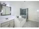 Bathroom featuring soaking tub, walk-in shower, and white vanity at 4274 Meeting Pl, Sanford, FL 32773