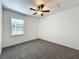 Bright bedroom features a ceiling fan, window and neutral color scheme at 4274 Meeting Pl, Sanford, FL 32773