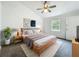 Tranquil bedroom boasts neutral decor, comfortable bed, bright window, and vaulted ceiling for a cozy retreat at 4274 Meeting Pl, Sanford, FL 32773