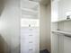 Walk-in closet with custom shelving and storage drawers at 4274 Meeting Pl, Sanford, FL 32773