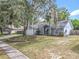 Charming single-story home featuring mature trees, well-maintained lawn, and attached two-car garage at 4274 Meeting Pl, Sanford, FL 32773
