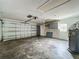 Spacious garage with concrete flooring, water heater and a garage door at 4274 Meeting Pl, Sanford, FL 32773