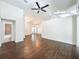 Spacious living room featuring hardwood floors, modern lighting, neutral color palette, and open floor plan at 4274 Meeting Pl, Sanford, FL 32773
