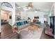 Open-concept living room features modern furniture, stylish decor, with kitchen and dining areas in the background at 4274 Meeting Pl, Sanford, FL 32773