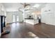 Open living room with hardwood floors, fireplace, kitchen, and lots of natural light at 4274 Meeting Pl, Sanford, FL 32773