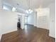 Spacious living room featuring hardwood floors, modern lighting, neutral color palette, and open floor plan at 4274 Meeting Pl, Sanford, FL 32773