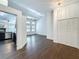 Spacious living room featuring hardwood floors, modern lighting, neutral color palette, and open floor plan at 4274 Meeting Pl, Sanford, FL 32773