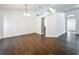 Bright living room featuring hardwood floors, modern lighting, and neutral color palette at 4274 Meeting Pl, Sanford, FL 32773