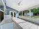 Tiled screened-in patio with backyard views and ample natural light at 4274 Meeting Pl, Sanford, FL 32773