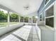 Screened patio with tile floors, ceiling fan and outdoor access at 4274 Meeting Pl, Sanford, FL 32773