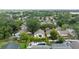 Aerial view of a residential neighborhood featuring houses with pools and well-maintained landscaping at 4398 Fox Hollow Cir, Casselberry, FL 32707