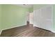 Empty bedroom with wood-look floors, and a large closet with sliding doors at 4398 Fox Hollow Cir, Casselberry, FL 32707