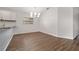 Dining area featuring modern lighting, wood-look floors, and neutral paint at 4398 Fox Hollow Cir, Casselberry, FL 32707