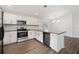 Modern kitchen with stainless steel appliances, stylish hardware, and light countertops at 4398 Fox Hollow Cir, Casselberry, FL 32707