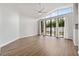 Bright living room with high ceilings, a wall of windows, and access to the backyard at 4398 Fox Hollow Cir, Casselberry, FL 32707