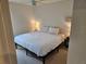 Bedroom showcasing a comfortable bed, neutral tones, and modern decor creating a relaxing atmosphere at 4564 Orchard Grove Rd, St Cloud, FL 34772