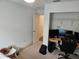 Bedroom featuring walk-in closet, bright neutral walls, carpet and convenient workspace for a functional layout at 4564 Orchard Grove Rd, St Cloud, FL 34772