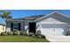 Charming single-story home featuring a well-manicured lawn and a two-car garage in a lovely neighborhood at 4564 Orchard Grove Rd, St Cloud, FL 34772