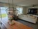 Bright living room with modern lighting, sleek floors, and stylish furniture creating a welcoming atmosphere at 4564 Orchard Grove Rd, St Cloud, FL 34772