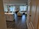 Inviting living area with modern lighting, sleek floors, and stylish furniture in an open-concept layout at 4564 Orchard Grove Rd, St Cloud, FL 34772