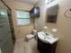 Updated bathroom with shower, modern fixtures and updated vanity and sink at 4631 America St, Orlando, FL 32811