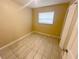 Cozy bedroom with neutral walls, tile flooring and bright window at 4631 America St, Orlando, FL 32811