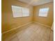 Comfortable bedroom with tiled flooring and natural light at 4631 America St, Orlando, FL 32811