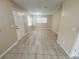 Expansive living room boasting tile floors, neutral walls and bright natural light from large windows at 4631 America St, Orlando, FL 32811