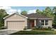 Charming one-story home with a well-maintained lawn and attached two-car garage at 4917 Bluebell Ct, Lake Hamilton, FL 33851
