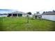 Spacious backyard with a fenced perimeter and a shed providing additional storage at 6011 Country Walk Ln, Winter Haven, FL 33880