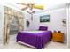 Cozy bedroom featuring a single bed, complemented by soft decor and natural light at 6011 Country Walk Ln, Winter Haven, FL 33880
