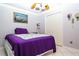 Comfortable bedroom featuring a single bed, complemented by soft decor and wall art at 6011 Country Walk Ln, Winter Haven, FL 33880