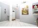 Bright entryway features tile flooring, a stylish pendant light, and attractive decor at 6011 Country Walk Ln, Winter Haven, FL 33880