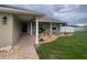 Inviting exterior with manicured landscaping, a paved walkway, and a well-maintained lawn at 6011 Country Walk Ln, Winter Haven, FL 33880
