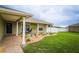Charming home with a well-manicured lawn and landscaping, featuring a covered entryway and a peaceful ambiance at 6011 Country Walk Ln, Winter Haven, FL 33880