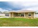 Charming single-story home with a well-maintained lawn, neutral exterior, and a driveway leading to the garage at 6011 Country Walk Ln, Winter Haven, FL 33880