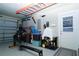 Well-organized garage space, epoxy flooring, equipped with a backup generator and gym equipment at 6011 Country Walk Ln, Winter Haven, FL 33880