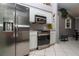 Stainless steel kitchen appliances including a refrigerator and stove in a well-lit kitchen at 6011 Country Walk Ln, Winter Haven, FL 33880