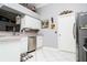 Bright kitchen featuring stainless steel appliances, a corner sink, white cabinets, and eye-catching decor at 6011 Country Walk Ln, Winter Haven, FL 33880