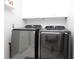 Convenient laundry room equipped with a modern washer and dryer set at 6011 Country Walk Ln, Winter Haven, FL 33880