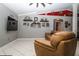 Inviting living room with a large TV, comfortable seating, a ceiling fan, and stylish decor at 6011 Country Walk Ln, Winter Haven, FL 33880
