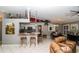 Open-concept living space with modern decor, high ceilings, and comfortable seating area at 6011 Country Walk Ln, Winter Haven, FL 33880