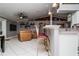 Open-concept living room and kitchen area with comfortable seating and modern decor at 6011 Country Walk Ln, Winter Haven, FL 33880