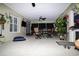 Inviting covered patio with dining area, ceiling fans, and views of the backyard at 6011 Country Walk Ln, Winter Haven, FL 33880